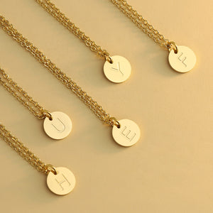Deeply carved round letter necklace