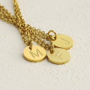 Deeply carved round letter necklace